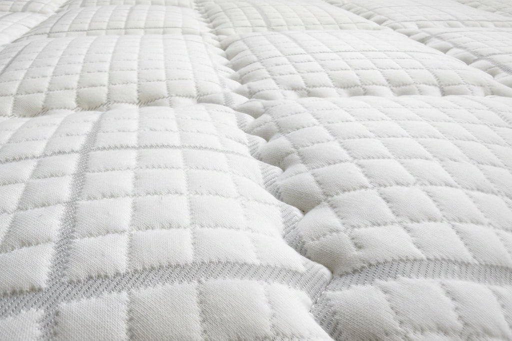 Textured white fabric with a checkered pattern on a black background