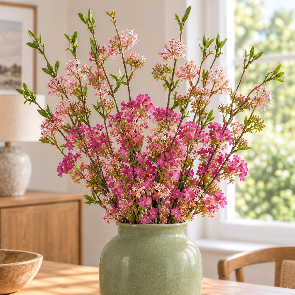 Pack of 6 x 100cm Pink Blossom Spray Stem styled in a room