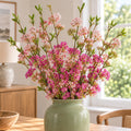 Pack of 6 x 100cm Pink Blossom Spray Stem styled in a room