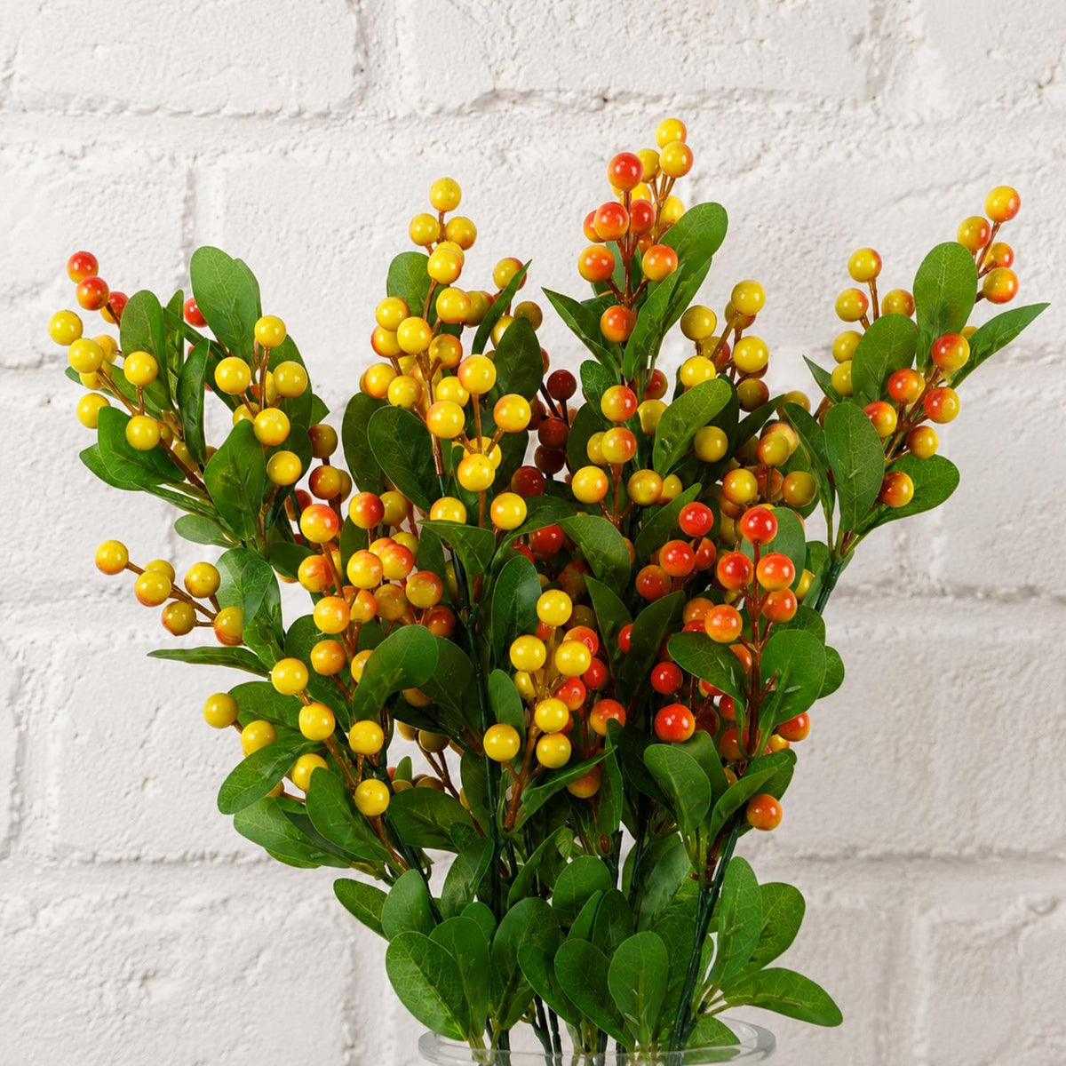 Pack of 6 x 70cm Artificial Orange Berry Spray styled in a room