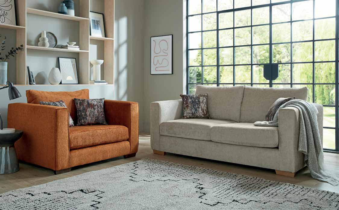 Ludlow slim-arm fabric armchair in a bright living room