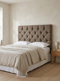 Whitby headboard in Linoso Sand fabric on a made-up bed