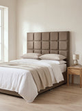 Topaz headboard in Linoso Sand fabric on a made-up bed
